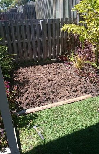 During - Garden makeover in Carindale - I have prepared the soil by turning it over and adding some fertiliser, ready for when the plants go in.