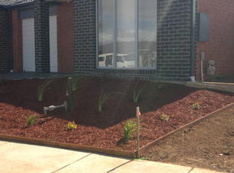 Vip budget line landscaping on domestic sites, including jarrah edging, treated pine sleeper retainer, mulching & native plant selection.