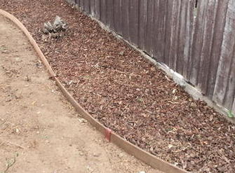 Vip budget line landscaping continued, including jarrah edging & steel pins,10ml pine bark