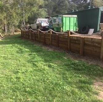 Retaining wall - This wall&nbsp;is a 25 mt treated pine sleeper wall built for extra parking next to the customers shed. &nbsp;As you can see it is capable of housing not only a car but also a trailer if required. During the construstion I used my tractor to backfill to the same ground level as the shed.
